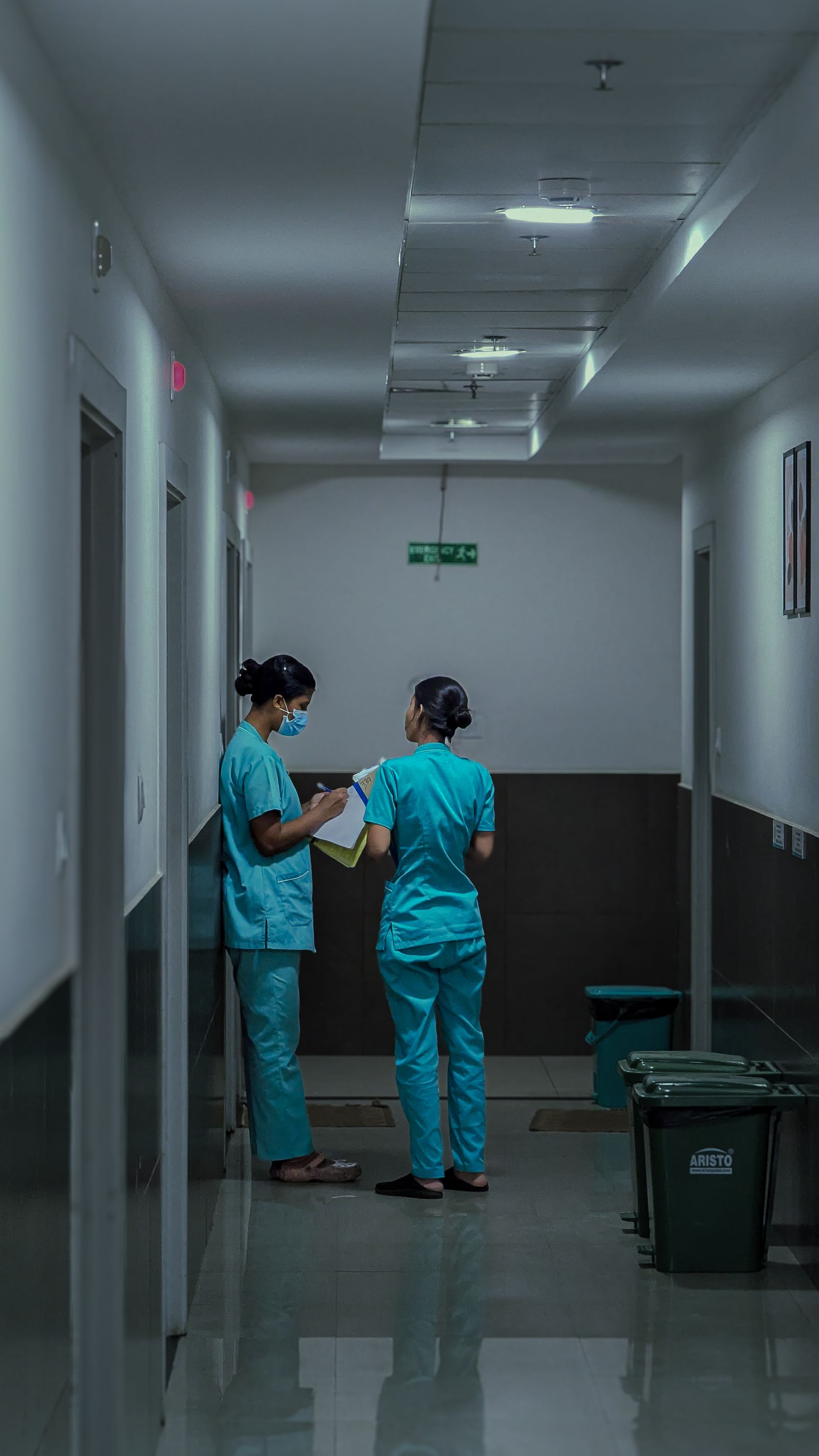 Indian nurses discussing patient care at home