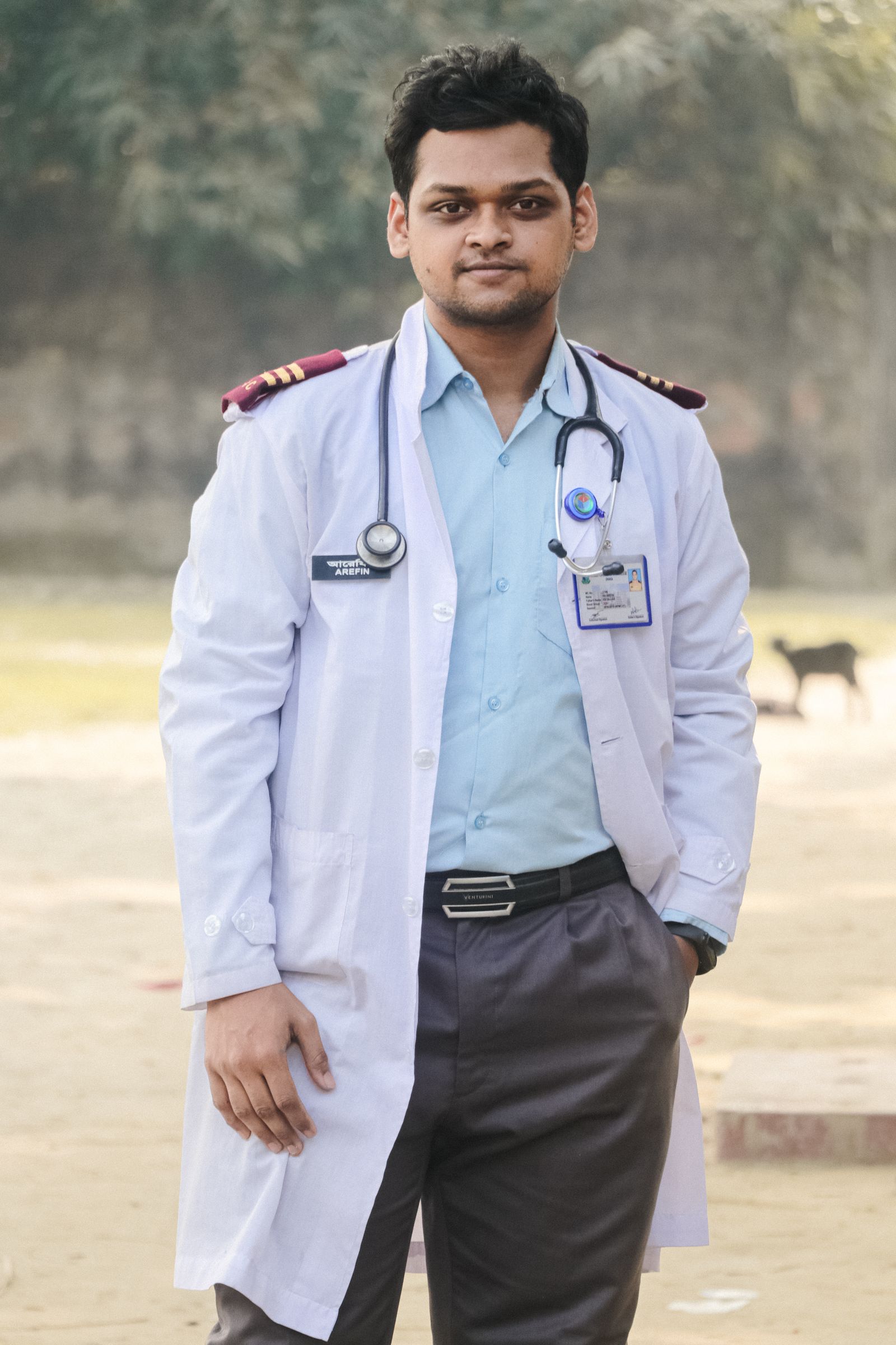 Indian physiotherapist helping patient at home